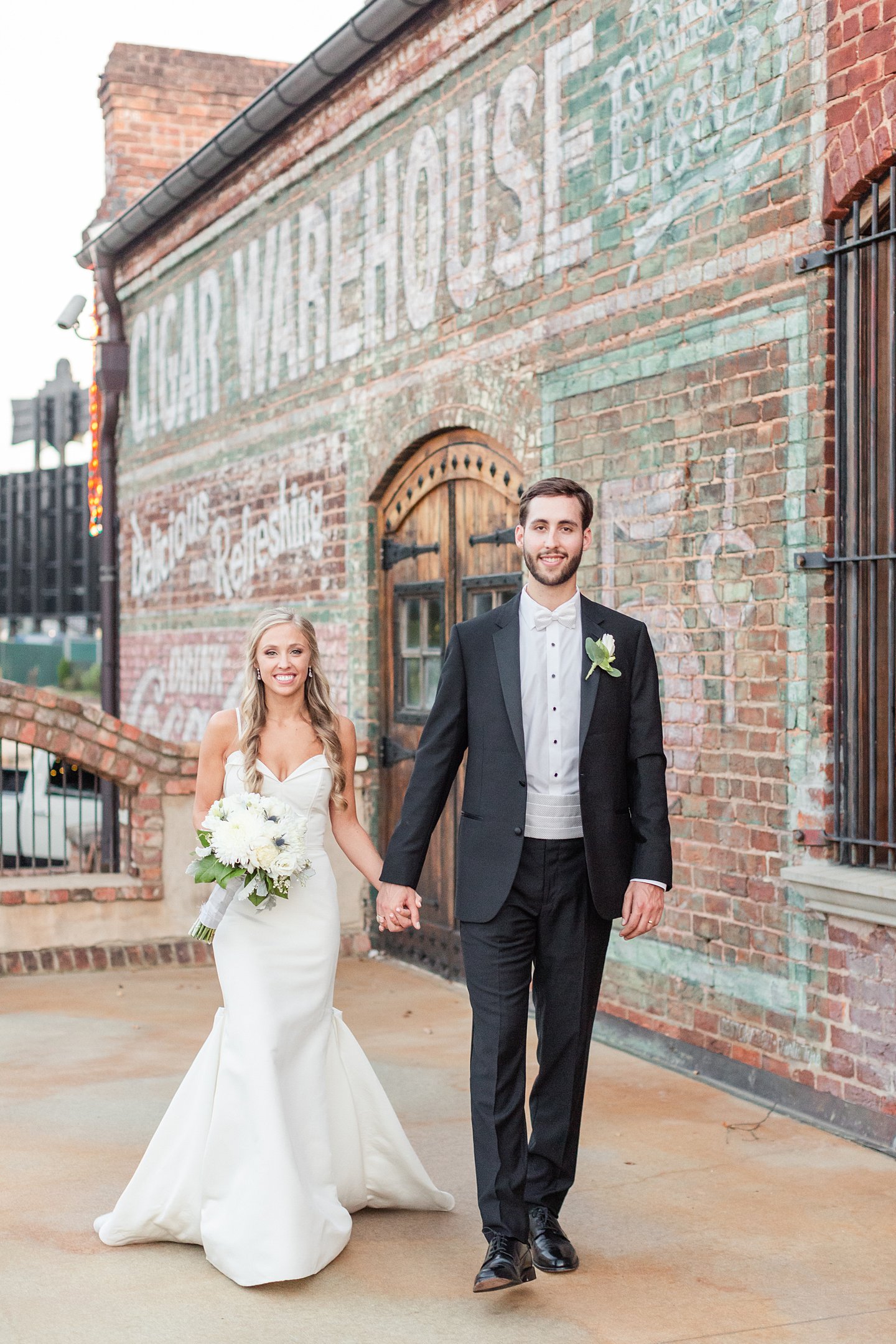 bride and groom wedding portrait at old cigar warehouse in greenville